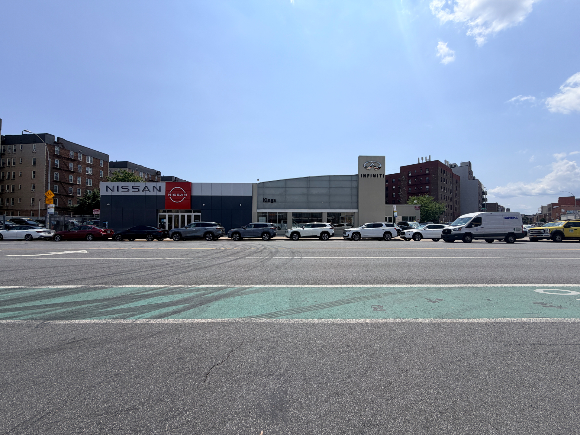 20 Neptune Avenue — Neptune Avenue elevation, showing the full 238-foot dealership frontage